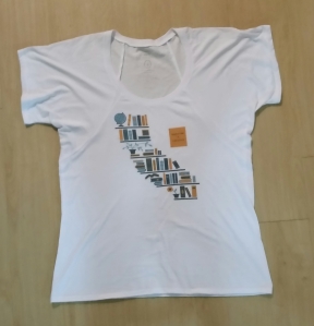 Education is Freedom: White scoop neck shirt with state of CA made out of books